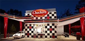 Checkers drive-thru with menu at night