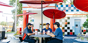 Checkers patio seating with tables and umbrellas