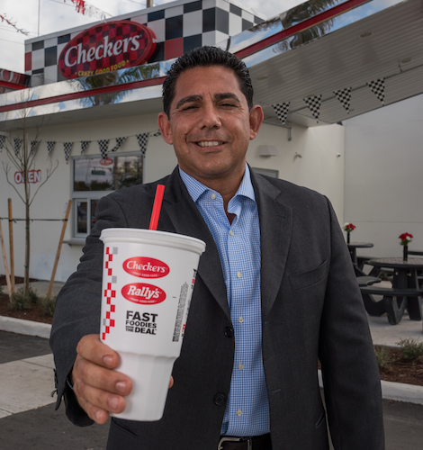 Angelo holding a Checkers and Rally's beverage